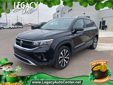 2022 Volkswagen Taos 1.5T SE in a Deep Black Pearl exterior color and Blackinterior. Legacy Auto Center 620-315-9264 legacyautocenter.net 