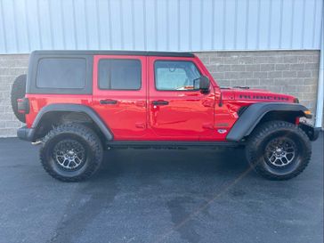 2022 Jeep Wrangler Unlimited Rubicon in a Firecracker Red Clear Coat exterior color and Blackinterior. Wilmington Auto Center Chrysler Dodge Jeep Ram (937) 556-6430 wilmingtonautocentercdjr.com 