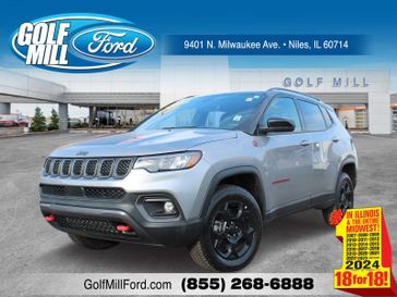 2023 Jeep Compass Trailhawk in a Billet Silver Metallic Clear Coat exterior color and Ruby Red/Blackinterior. Glenview Luxury Imports 847-904-1233 glenviewluxuryimports.com 