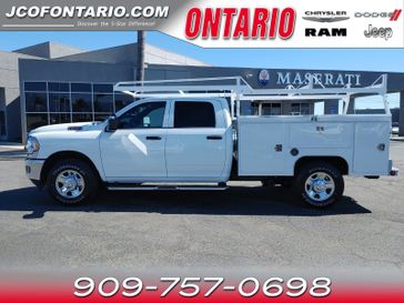 2023 RAM 2500 Tradesman in a Bright White Clear Coat exterior color and Diesel Gray/Blackinterior. Ontario Auto Center ontarioautocenter.com 
