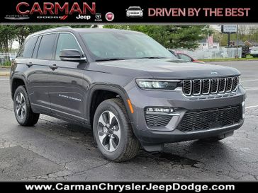 2024 Jeep Grand Cherokee 4xe in a Baltic Gray Metallic Clear Coat exterior color and Global Blackinterior. Carman Chrysler Jeep Dodge Ram 302-317-2378 carmanchryslerjeepdodge.com 