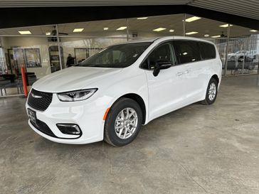 2024 Chrysler Pacifica Touring L in a Bright White Clear Coat exterior color. Shields Motor Company Inc (620) 902-2035 shieldsmotorchryslerdodgejeep.com 