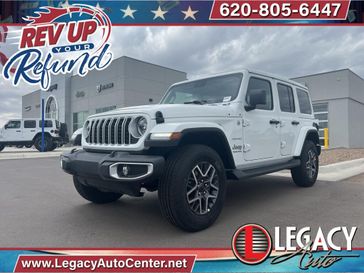 2024 Jeep Wrangler 4-door Sahara in a Bright White Clear Coat exterior color and Blackinterior. Legacy Auto Center 620-315-9264 legacyautocenter.net 