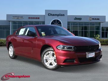 2023 Dodge Charger SXT Rwd in a Octane Red exterior color and HOUNDSTOOTHinterior. Champion Chrysler Jeep Dodge Ram 800-549-1084 pixelmotiondemo.com 