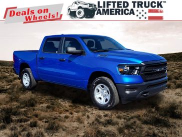 2024 RAM 1500 Tradesman in a Hydro Blue Pearl Coat exterior color and Blackinterior. Lifted Truck America 888-267-0644 liftedtruckamerica.com 