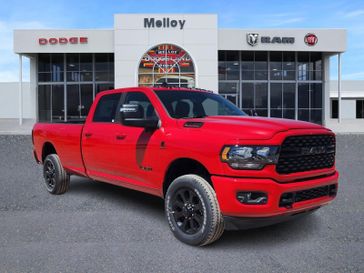 2024 RAM 3500 Big Horn in a Flame Red Clear Coat exterior color and Blackinterior. Lifted Truck America 888-267-0644 liftedtruckamerica.com 