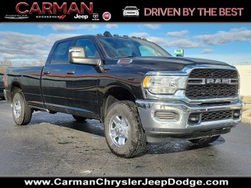 2024 RAM 2500 Tradesman Crew Cab 4x4 8' Box in a Diamond Black Crystal Pearl Coat exterior color and Diesel Gray/Black - TXX8interior. Carman Chrysler Jeep Dodge Ram 302-317-2378 carmanchryslerjeepdodge.com 