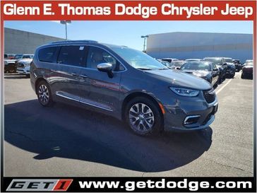 2023 Chrysler Pacifica Plug-in Hybrid Pinnacle in a Ceramic Gray Clear Coat exterior color and Caramel/Blackinterior. Glenn E Thomas 100 Years Of Excellence (866) 340-5075 getdodge.com 