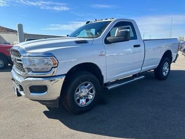 2024 RAM 3500 Tradesman Regular Cab 4x4 8' Box in a Bright White Clear Coat exterior color. Fillback Chrysler 6083754664 
