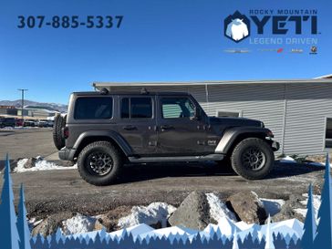 2020 Jeep Wrangler Sahara in a Granite Crystal Metallic Clear Coat exterior color and Blackinterior. Rocky Mountain Yeti Jackson Hole 307-733-5337 rockymountainyetijacksonhole.com 