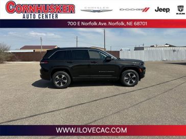 2023 Jeep Grand Cherokee 4xe in a Rocky Mountain Pearl Coat exterior color and Global Blackinterior. Cornhusker Auto Center 402-866-8665 cornhuskerautocenter.com 