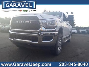 2024 RAM 2500 Tradesman Crew Cab 4x4 6'4' Box in a Bright White Clear Coat exterior color and Blackinterior. Garavel Jeep 475-258-7987 norwalkjeep.com 