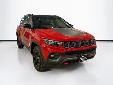 2023 Jeep Compass Trailhawk 4x4 in a Redline Pearl Coat exterior color and Ruby Red/Blackinterior. Sheridan Motors CDJR 307-218-2217 sheridanmotor.com 