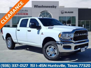 2024 RAM 2500 Tradesman Crew Cab 4x4 6'4' Box in a Bright White Clear Coat exterior color and Blackinterior. Wischnewsky Dodge 936-755-5310 wischnewskydodge.com 