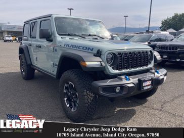 2024 Jeep Wrangler 4-door Rubicon 4xe in a Earl Clear Coat exterior color and Blackinterior. Legacy Chrysler Jeep Dodge RAM 541-663-4885 legacychryslerjeepdodgeram.com 