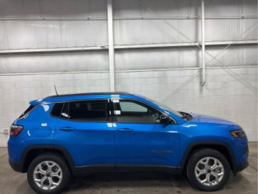 2025 Jeep Compass Latitude 4x4 in a Hydro Blue Pearl Coat exterior color. Wilmington Auto Center Chrysler Dodge Jeep Ram (937) 556-6430 wilmingtonautocentercdjr.com 