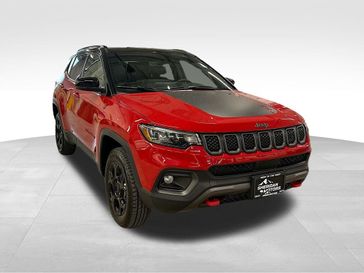 2023 Jeep Compass Trailhawk 4x4 in a Redline Pearl Coat exterior color and Ruby Red/Blackinterior. Sheridan Motors CDJR 307-218-2217 sheridanmotor.com 