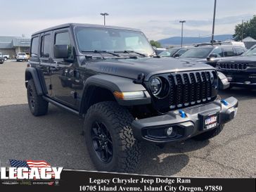 2024 Jeep Wrangler 4-door Willys 4xe in a Granite Crystal Metallic Clear Coat exterior color and Blackinterior. Legacy Chrysler Jeep Dodge RAM 541-663-4885 legacychryslerjeepdodgeram.com 