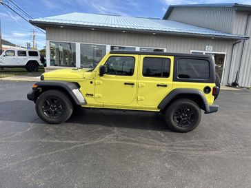 2023 Jeep Wrangler 4-door Sport Altitude 4x4 in a High Velocity Clear Coat exterior color and Blackinterior. Victor Chrysler Dodge Jeep Ram 585-236-4391 victorcdjr.com 