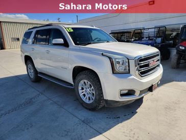 2015 GMC Yukon SLT in a White Diamond Tri Coat exterior color and Jet Blackinterior. Sahara Motors Inc 435-500-5052 saharamotorschryslerdodgejeep.com 