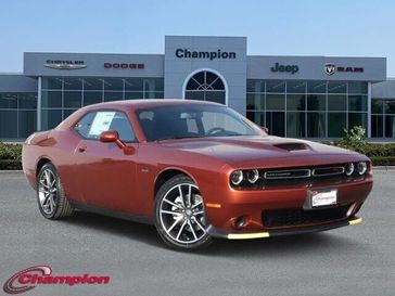 2023 Dodge Challenger R/T in a Sinamon Stick exterior color and HOUNDSTOOTHinterior. Champion Chrysler Jeep Dodge Ram 800-549-1084 pixelmotiondemo.com 
