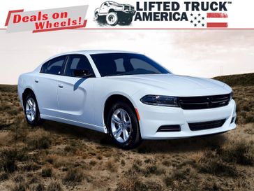 2023 Dodge Charger SXT in a White Knuckle Clear Coat exterior color and Blackinterior. Lifted Truck America 888-267-0644 liftedtruckamerica.com 
