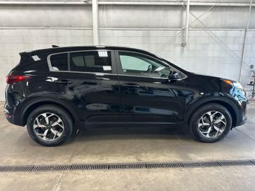 Used 2022 Kia Sportage LX in a Black Cherry exterior color and Blackinterior. Wilmington Auto Center Chrysler Dodge Jeep Ram (937) 556-4751 wilmingtonautocentercdjr.com 