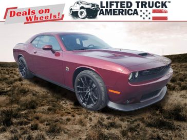2023 Dodge Challenger R/T Scat Pack in a Octane Red Pearl Coat exterior color and Blackinterior. Lifted Truck America 888-267-0644 liftedtruckamerica.com 