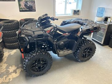 2024 Polaris Sportsman 570 Trail in a Black w/Red exterior color. Mettler Implement mettlerimplement.com 
