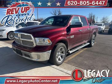 2017 RAM 1500 Laramie in a Delmonico Red Pearl Coat exterior color and Blackinterior. Legacy Auto Center 620-315-9264 legacyautocenter.net 