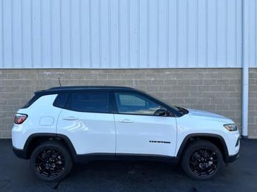 2024 Jeep Compass Latitude 4x4 in a Bright White Clear Coat exterior color and Blackinterior. Wilmington Auto Center Chrysler Dodge Jeep Ram (937) 556-6430 wilmingtonautocentercdjr.com 