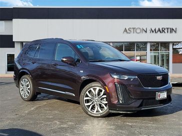 2021 Cadillac XT6 Sport in a Red exterior color and Cirrus/Jet Black Accentsinterior. Aston Martin of Glenview 847-904-1233 astonmartinofglenview.com 