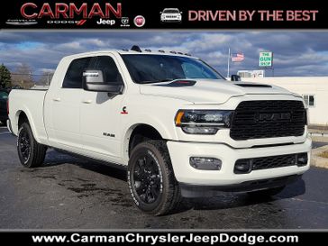 2024 RAM 2500 Limited Mega Cab 4x4 6'4' Box in a Pearl White exterior color and Black - ULX9interior. Carman Chrysler Jeep Dodge Ram 302-317-2378 carmanchryslerjeepdodge.com 