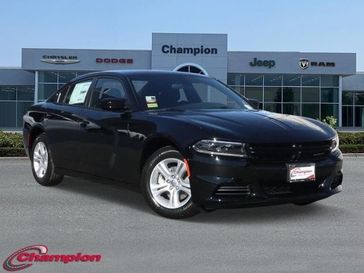 2023 Dodge Charger SXT Rwd in a Pitch Black exterior color and HOUNDSTOOTHinterior. Champion Chrysler Jeep Dodge Ram 800-549-1084 pixelmotiondemo.com 