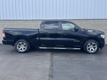 2024 RAM 1500 Big Horn 4x4 Crew Cab 64 Box in a Diamond Black Crystal Pearl Coat exterior color and Blackinterior. Wilmington Auto Center Chrysler Dodge Jeep Ram (937) 556-6430 wilmingtonautocentercdjr.com 