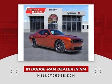 2022 Dodge Challenger  in a Sinamon Stick exterior color and Blackinterior. Melloy Dodge RAM FIAT 505-588-4459 melloydodge.com 