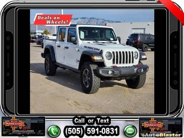 2022 Jeep Gladiator Rubicon in a Bright White Clear Coat exterior color and Blackinterior. Melloy Dodge RAM FIAT 505-588-4459 melloydodge.com 