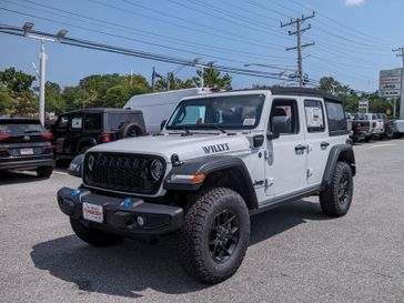 2024 Jeep Wrangler 4xe 4-Door Willys in a Bright White Clear Coat exterior color and Blackinterior. Don White's Timonium Chrysler Dodge Jeep Ram 410-881-5409 donwhites.com 