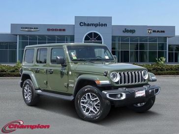 2024 Jeep Wrangler 4-door Sahara in a Sarge Green Clear Coat exterior color and CLOTHinterior. Champion Chrysler Jeep Dodge Ram 800-549-1084 pixelmotiondemo.com 