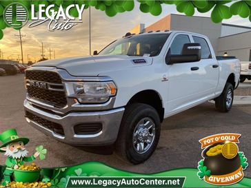 2024 RAM 2500 Tradesman Crew Cab 4x4 6'4' Box in a Bright White Clear Coat exterior color and Blackinterior. Legacy Auto Center 620-315-9264 legacyautocenter.net 