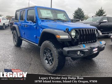 2024 Jeep Wrangler 4-door Willys 4xe in a Hydro Blue Pearl Coat exterior color and Blackinterior. Legacy Chrysler Jeep Dodge RAM 541-663-4885 legacychryslerjeepdodgeram.com 