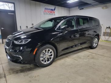 Used 2024 Chrysler Pacifica Touring L in a Diamond Black Crystal Pearl Coat exterior color. Jensen Chrysler Dodge Jeep Ram 507-354-0542 jensenchryslerdodgejeepram.com 