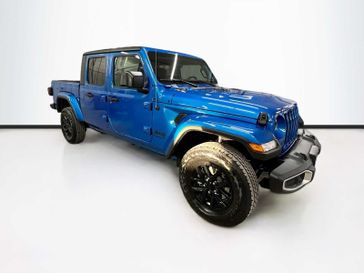 2023 Jeep Gladiator Sport S 4x4 in a Hydro Blue Pearl Coat exterior color and Blackinterior. Sheridan Motors CDJR 307-218-2217 sheridanmotor.com 