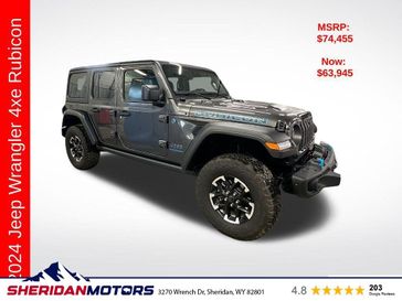 2024 Jeep Wrangler 4-door Rubicon 4xe in a Granite Crystal Metallic Clear Coat exterior color and Blackinterior. Sheridan Motors CDJR 307-218-2217 sheridanmotor.com 