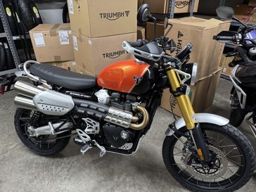 2025 Triumph Scrambler 1200 XE Baja Orange / Phantom Black  in a ORANGE exterior color. Cascade Moto Eugene 541-338-0269 cascademotoeugene.com 