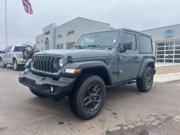 2024 Jeep Wrangler 2-door Sport S in a Anvil Clear Coat exterior color and Blackinterior. Legacy Auto Center 620-315-9264 legacyautocenter.net 