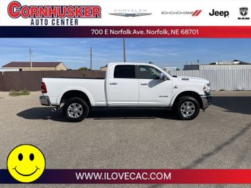 2022 RAM 2500 Laramie in a Bright White Clear Coat exterior color and Blackinterior. Cornhusker Auto Center 402-866-8665 cornhuskerautocenter.com 