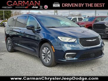 2023 Chrysler Pacifica Plug-in Hybrid Touring L in a Fathom Blue Pearl Coat exterior color and Black/Alloy/Blackinterior. Carman Chrysler Jeep Dodge Ram 302-317-2378 carmanchryslerjeepdodge.com 