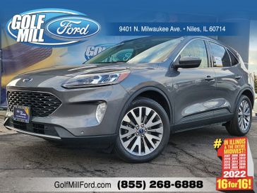 2022 Ford Escape Titanium Hybrid in a Carbonized Gray Metallic exterior color and Ebonyinterior. Glenview Luxury Imports 847-904-1233 glenviewluxuryimports.com 