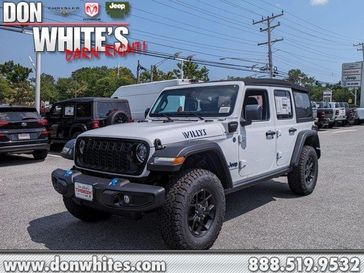 2024 Jeep Wrangler 4xe 4-Door Willys in a Bright White Clear Coat exterior color and Blackinterior. Don White's Timonium Chrysler Dodge Jeep Ram 410-881-5409 donwhites.com 